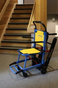 An Evac-Chair beside a set of stairs.